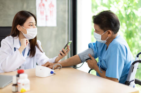 Doctor advising a patient in her office.
